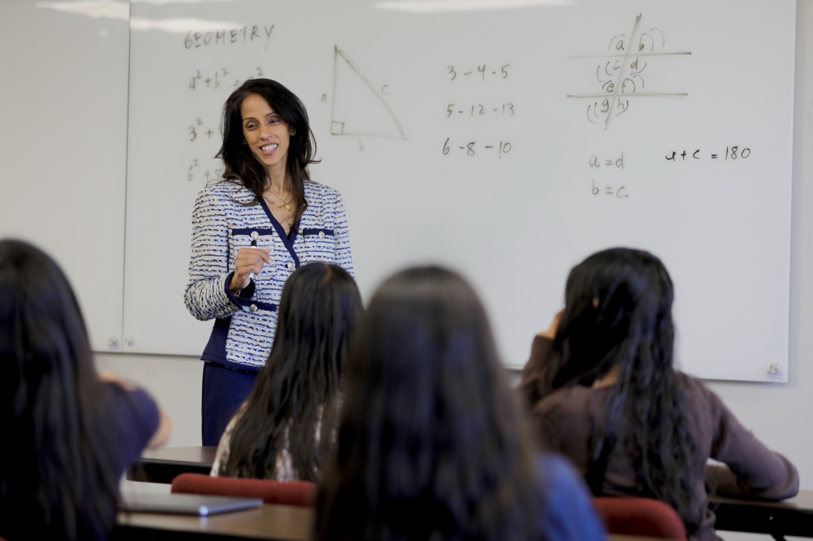 Rakhi teaching in a classroom